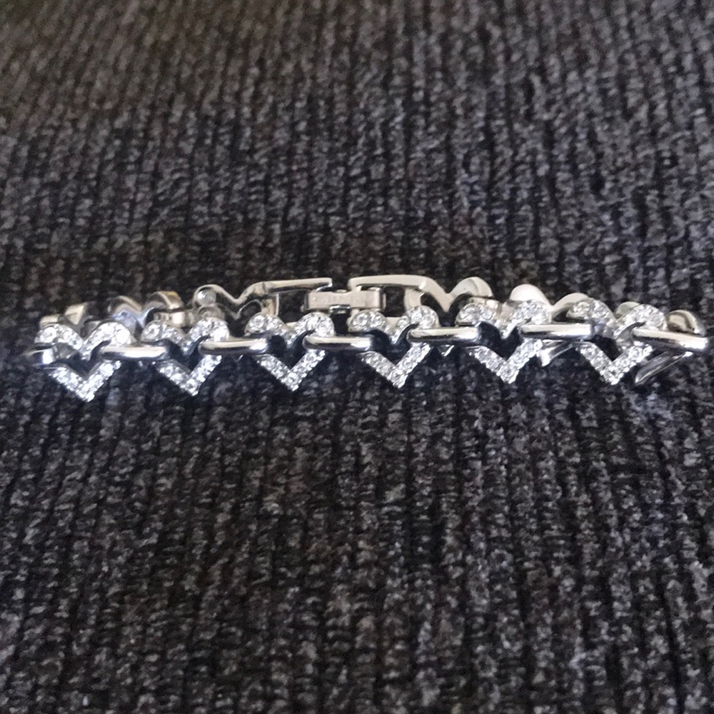 Silver toned and crystal hearts bracelet